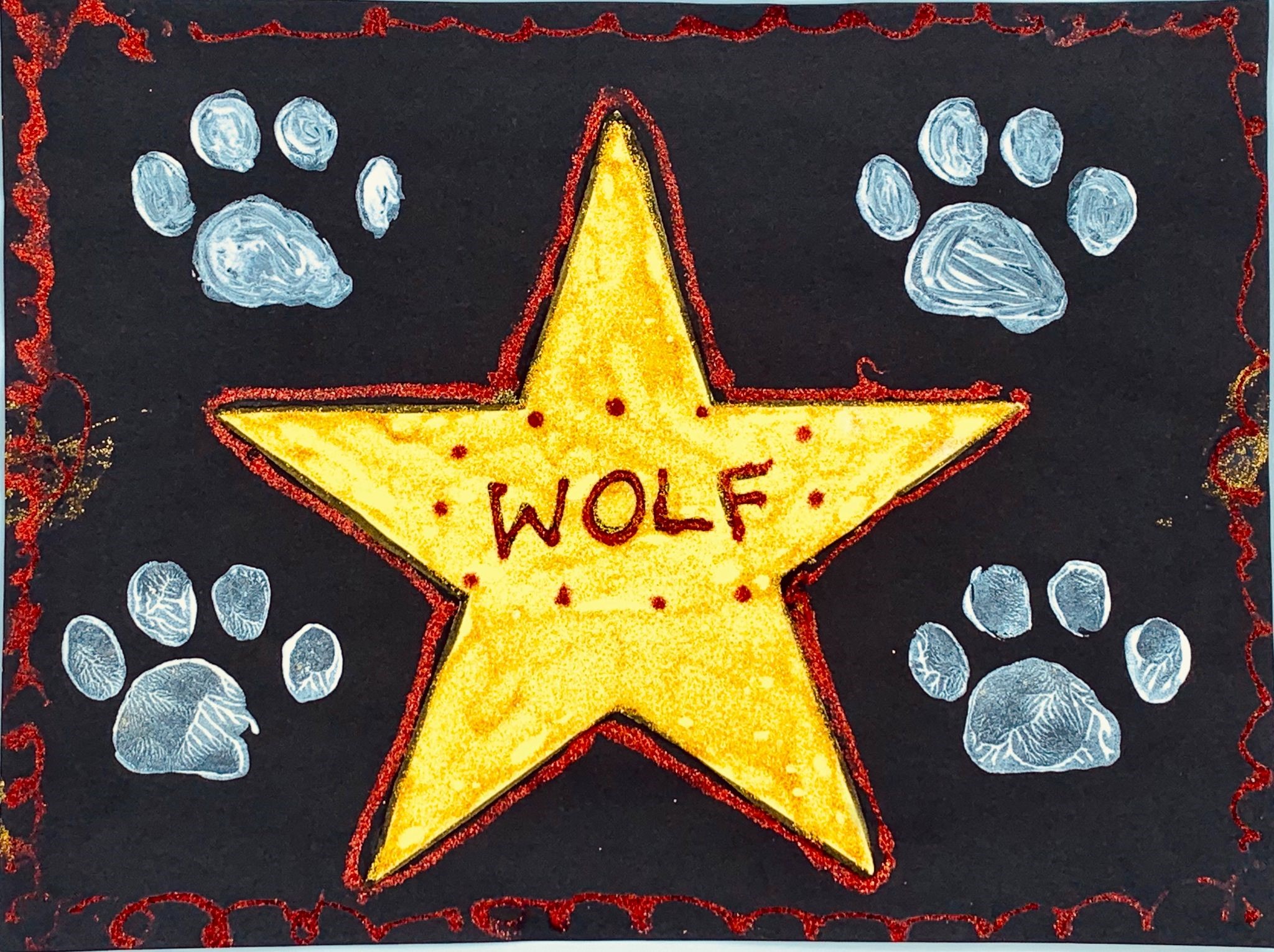 Picture of paw prints and star.