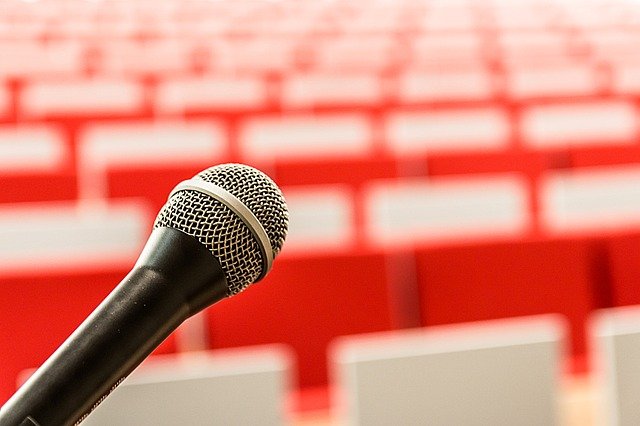 microphone with empty stadium seating in background