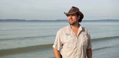 Ranger Rob in front of the ocean