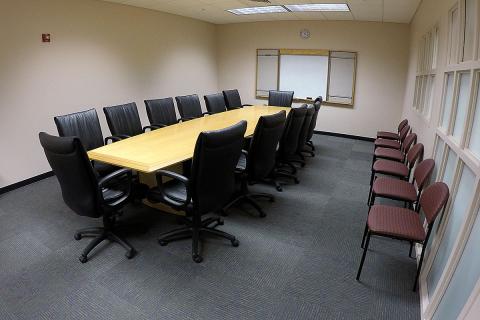 Room image of the Cape Coral Lee Conference Room complete with a conference table and multiple chairs