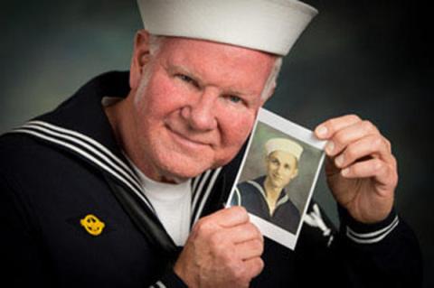 Gary Vidito poses with a photo of his father.