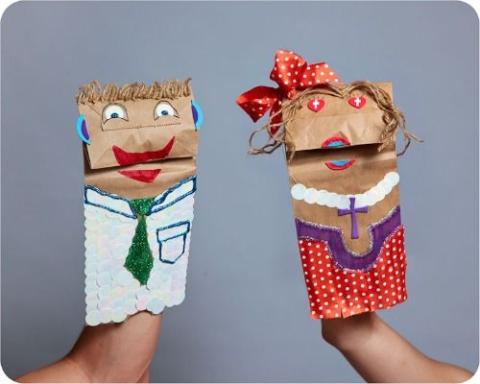 Two hand crafted paper bag puppets