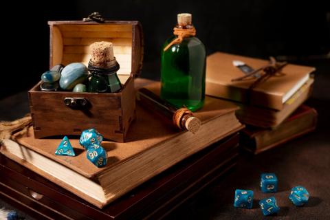 Dice and potions scattered around a tabletop.