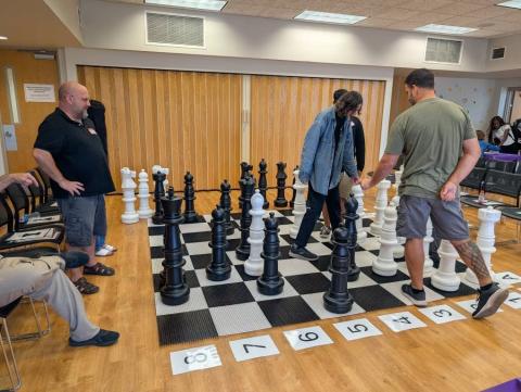 Interactive chess with teens. Coaches on hand for educational play. 