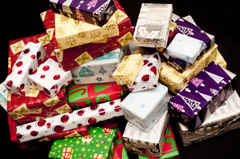 A pile of wrapped holiday gifts