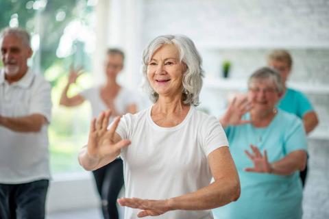 Adults participating in a Tai Chi class