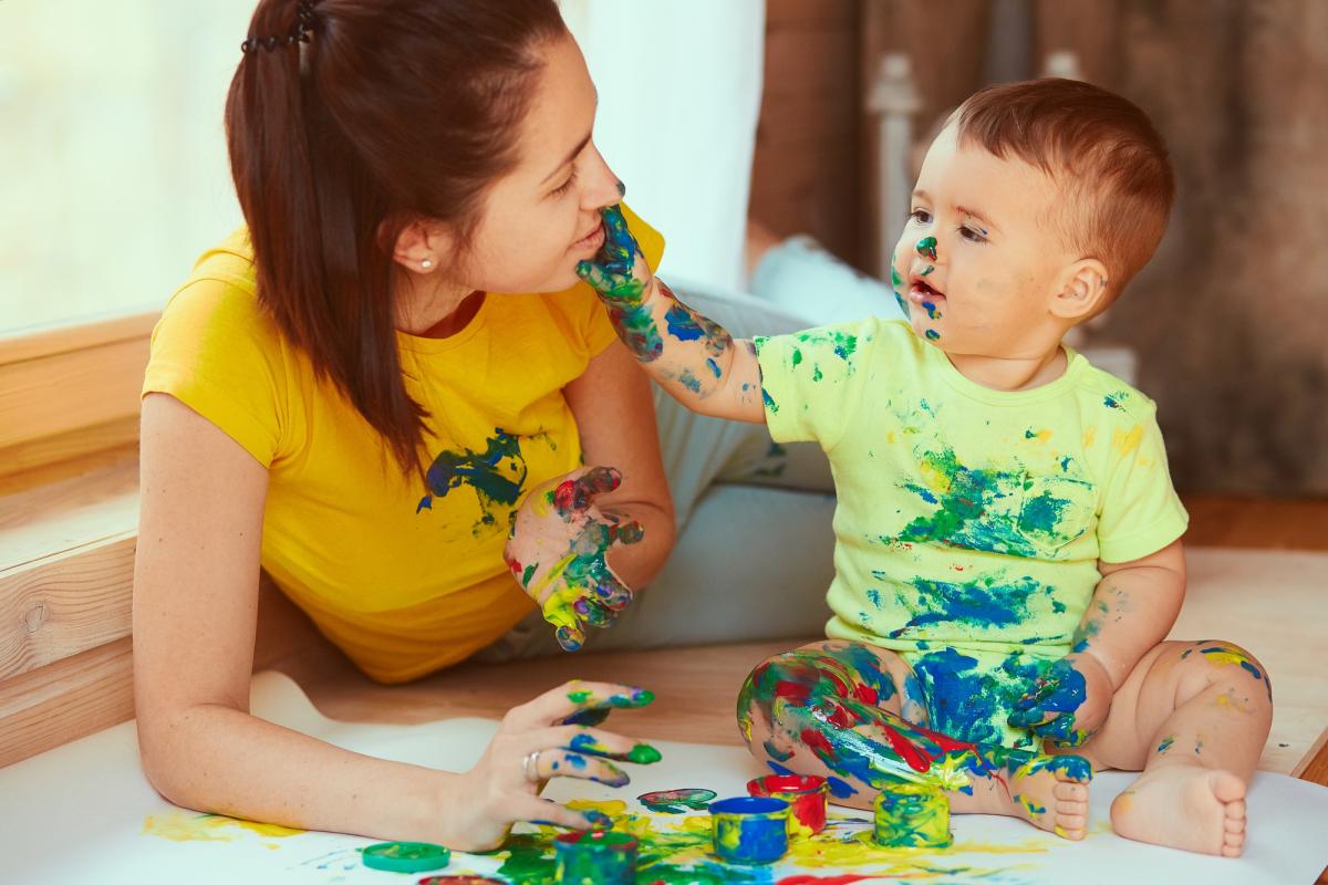 child and parent paint messy play
