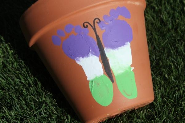 Pottery with baby footprint painted to look like butterfly design