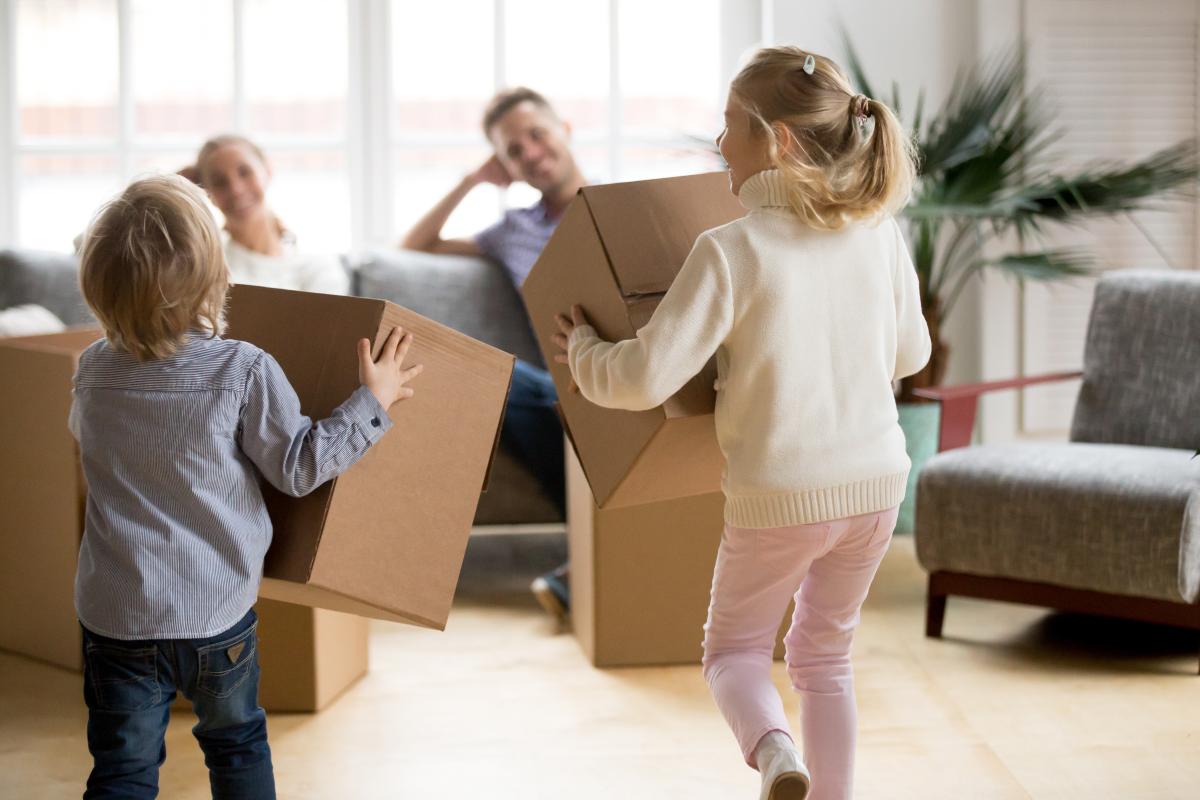 family with cardboard boxes